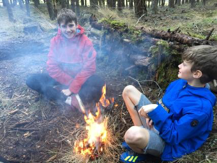 Boys tending the fire